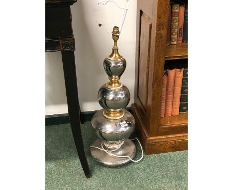 A LARGE SILVERED AND GILT DECORATED POTTERY TABLE LAMP. 