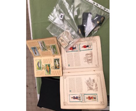 A COLLECTION OF CIGARETTE CARDS AND VINTAGE CROWNS. 