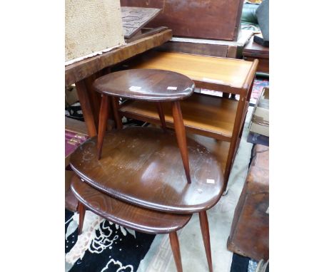 A NEST OF THREE ERCOL TABLES TOGETHER WITH A 1970S TEAK THREE TIER TROLLEY