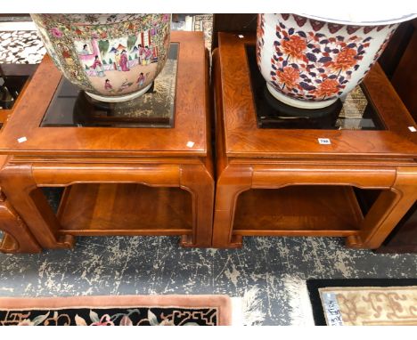 A PAIR OF MODERN CHINESE HARD WOOD TABLES, EACH WITH BEVELLED GLASS TOPS AND ON SCROLL LEGS JOINED BY AN UNDERTIER.   W 73 x 