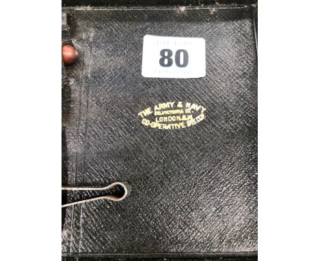 AN ANTIQUE LEATHER CASED PHARMACISTS BOX AND CONTENTS BY THE ARMY AND NAVY STORES. 
