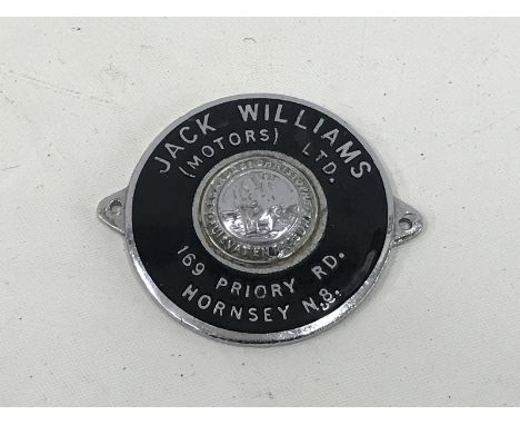 An enamel dealership supply plate for Jack Williams (Motors) Limited, 169 Priory Road, Hornsey, with central St. Christopher 