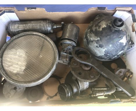A box of assorted vintage Bentley parts to include a Brolt stirrup mounted headlamp, bonnet catches, wheel nuts etc. 