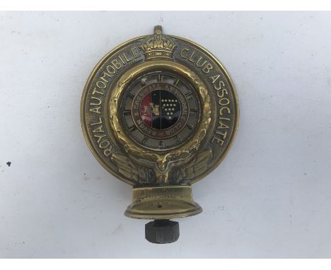 An RAC Associate car badge with Devon and Cornwall Automobile Club part enamel centre, brass 1908 pattern, no. B18.