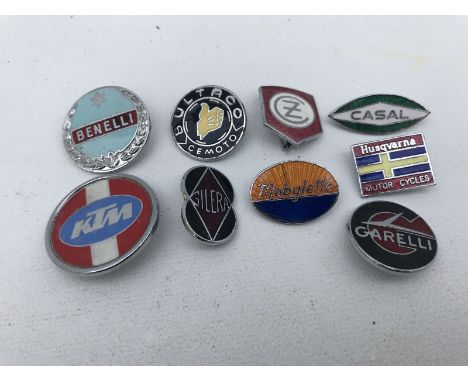 Nine motorcycle enamel lapel badges.