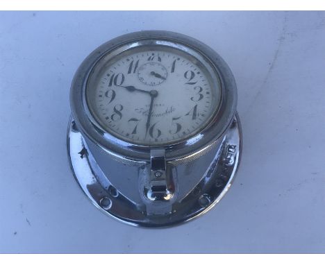 A Doxa Automobile car clock on sloping mount for a low down dashboard, to suit an Edwardian motor car.