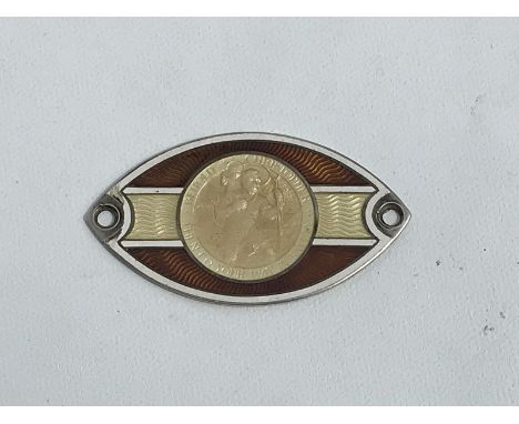 A hallmarked silver oval enamel St. Christopher dashboard plaque. 