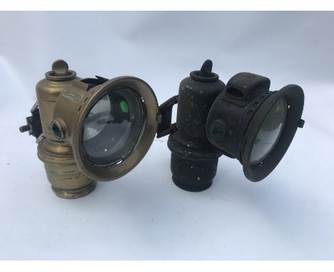 A Lucas carbide brass lamp and one other. 