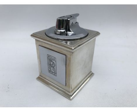 A desktop Ronson lighter bearing a Rolls-Royce plaque to the front. 