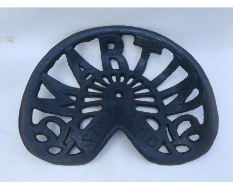 A Martin of Stamford cast tractor seat. 