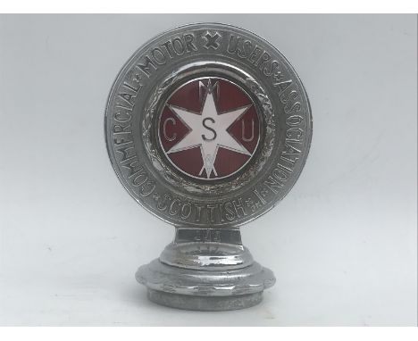 A Scottish Commercial Motor Users Association badge, chrome, no. 111, on a radiator cap, red enamel centre with white star.