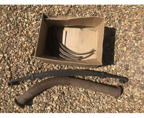 A front exhaust pipe, a road spring and a quantity of brake linings, possibly vintage Bentley.