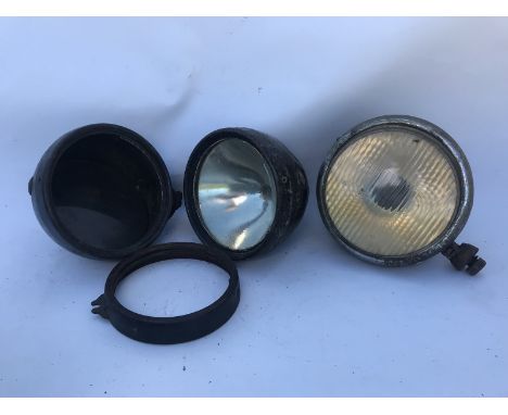 A pair of Rotax K588 lamps and a Lucas lamp.