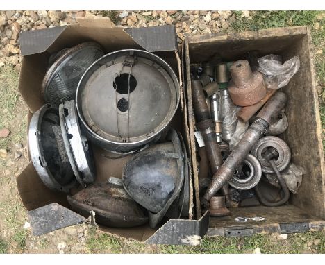 A box of sealed beam units, headlamp rims etc. and a box of hub parts.