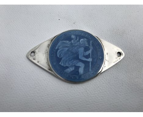 A sterling silver and pale blue enamel St. Christopher dashboard plaque. 