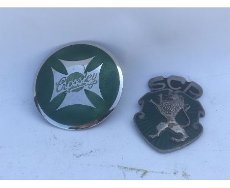 A Crossley circular part enamel badge, by repute restored and an unusual part enamel badge with prancing lion motif surmounte