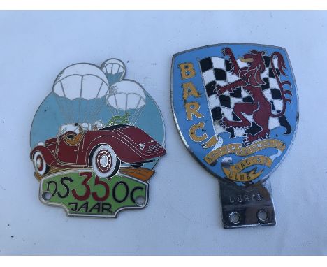 A BARC enamel badge, stamped L8973 and an unusual Continental badge for DSOC depicting a motor car and hot air balloons. 