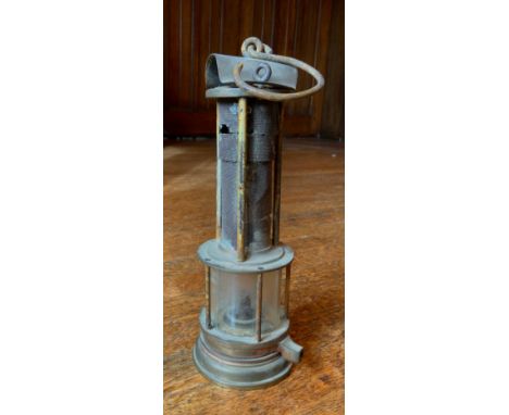 A Joseph Cooke Clanny type miners lamp, glass protected by five rods, the gauze  by three rods, 26cm high** We would please a
