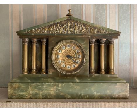 A 19th century onyx mantel clock, Arabic numerals, the architectural case with cast brass figural frieze, three freestanding 