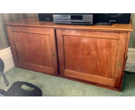 A Victorian mahogany low cabinet, with moulded rectangular top, two sliding doors, 55cm high, 126cm wide, 41cm deep, c.1860**