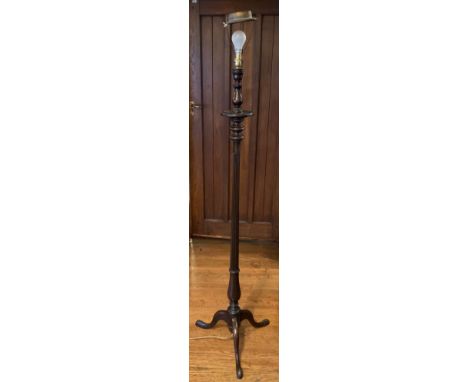 An early 20th century mahogany standard lamp, reeded column, tripod legs, pad feet** We would please ask that all payments ar