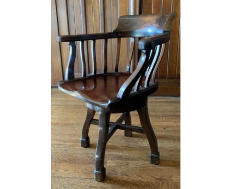 An early 20th century mahogany office swivel chair, shaped spindle back and seat, c.1900** We would please ask that all payme