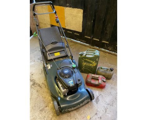A Hayter Harrier 56 petrol lawn mower, Briggs & Stratton; three petrol cans.** We would please ask that all payments are made