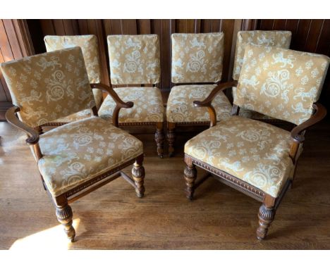 A set of twelve oak dining chairs, by Thomas Turner of Manchester, stuffed over back and seats, fluted seat rails, fluted cup