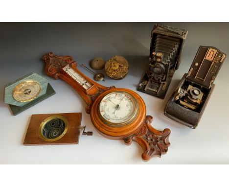A folding plate camera, Pronto shutter;  an Eastman Kodak folding camera;  clock parts;  an oak aneroid barometer;  etc** We 