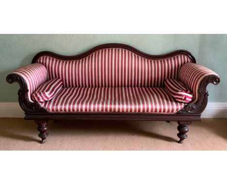 A Victorian mahogany sofa, leafy scroll arms, turned legs, red adn white striped upholstery, 208cm wide, c.1860** We would pl