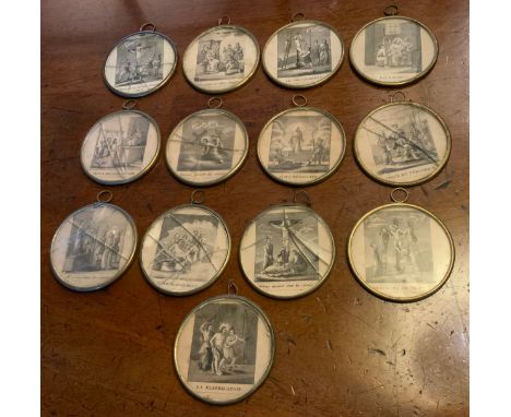 A set of thirteen French circular disc, each engraved  in monochrome with a religious scene, 6cm diam** We would please ask t