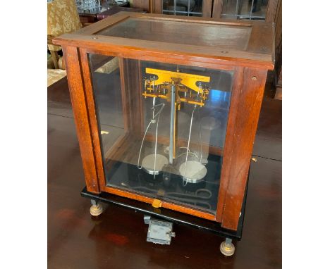 A set of early 20th Century mahogany and glass cased laboratory scales,  by Sutherland Thomson and Co Ltd, Wells, Somerset** 