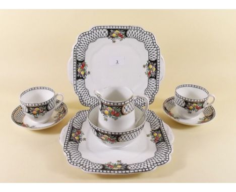 A Wellington China tea service comprising eleven cups and twelve saucers, twelve tea plates, two cake plates, sugar and jug -