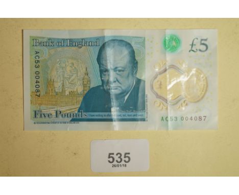 A new five pound note issued prefix no: AC53004087 - note has missing Big Ben and Crown monogram therefore possible collector