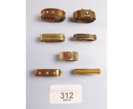 Seven Victorian pinchbeck or gilt metal scarf clips
