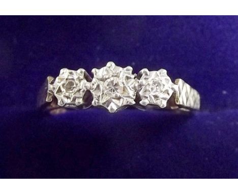 A 9 carat gold ring illusion set three diamonds , size K and a half