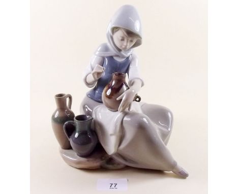 A Lladro group girl seated with ceramic pots