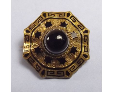 A Victorian pinchbeck agate brooch with enamel decoration