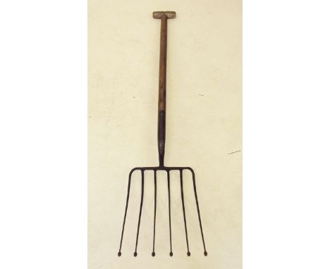 An antique beet/potato six pronged T-handled loading fork