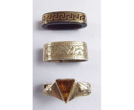 A Victorian tortoiseshell scarf clip inlaid with silver and gold Greek key design, a silver scarf clip set topaz and a silver