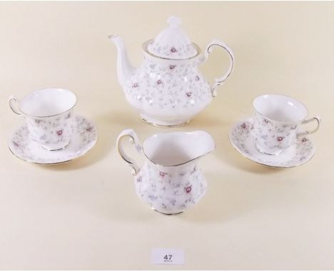 A Paragon 'First Choice' teaset comprising one cake plate, one teapot, one milk, one sugar, six tea plates and six cups and s