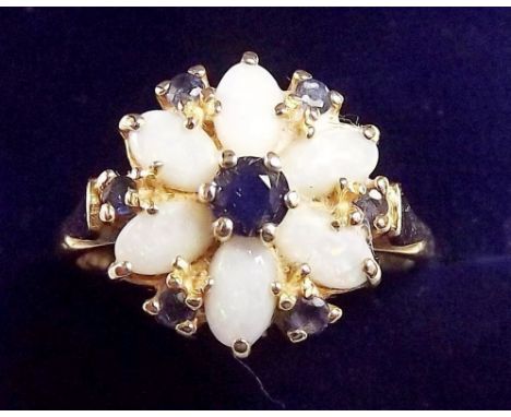 A 15 carat gold opal and sapphire cluster ring, size P and a half