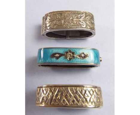 A sterling silver and blue enamel scarf clip and two other silver scarf clips