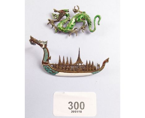 Two silver and enamel brooches in the form of a dragon and a dragon ship