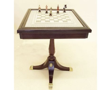 A Franklyn Mint chess set 'The Indian Sepoy Revolution 1857' in fitted chess board topped table