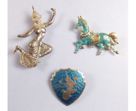 Two Siam silver and enamel dancing figure brooches and a similar horse brooch