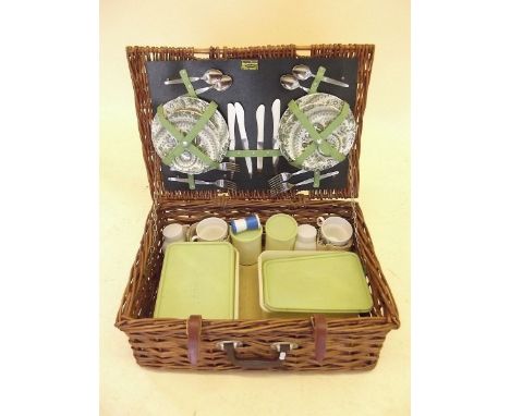 A Brexton wicker picnic hamper and contents with ceramic plates, tea cups etc