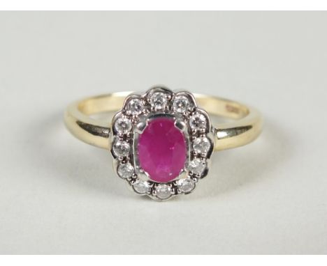 A 9ct gold ruby and diamond oval cluster ring