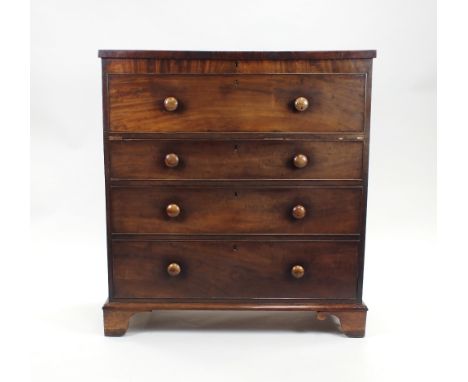 A Victorian mahogany chest of drawers,mid-19th century, the rectangular lift top above a false drawer front and a three gradu