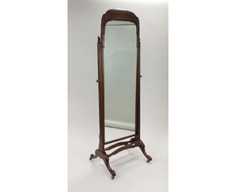 A George I style mahogany cheval mirror, the rectangular plate with slightly curved bracket surmount within finialled upright